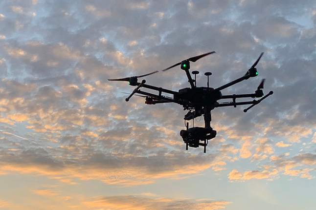 An airborne drone capturing aerial footage.