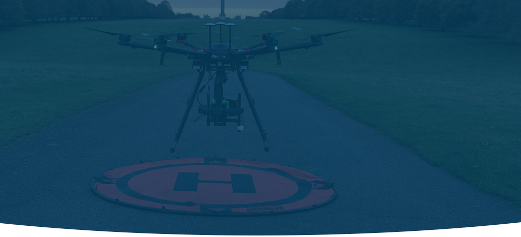 A darkened image of a drone taking-off at a national trust park to perform some visual inspections.
