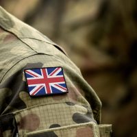 Flag of United Kingdom on military uniform.