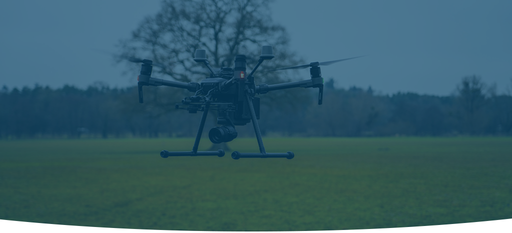 A dimmed image of an airborne drone during thermal inspections.