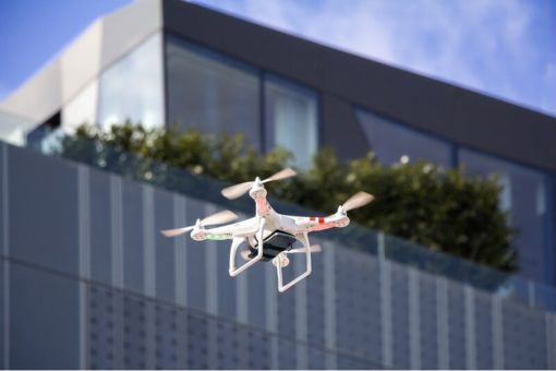 A drone flying around the city during a promotional video.