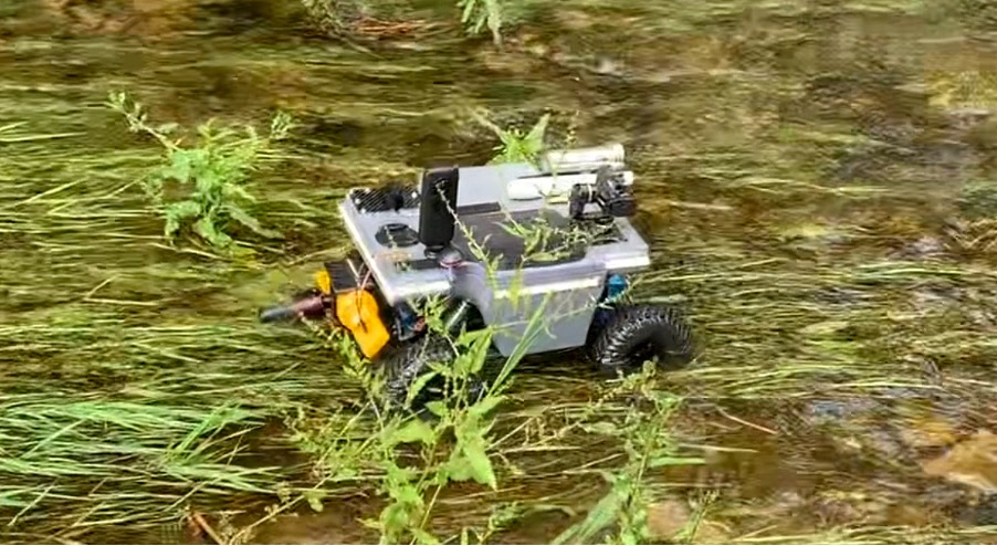 The "Little Geek" Amphibious ROV machine speeding across the rough terrain.