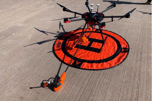 An unmanned aerial precision sprayer preparing for take-off.