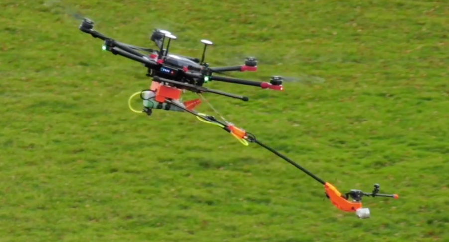 An unmanned aerial precision sprayer action shot.